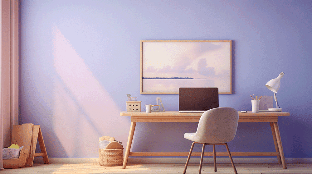 Having a clean and inspirational workspace is key for a productive morning routine. Picture of a minimalistic workspace with a desk with a computer and a painting on the wall.